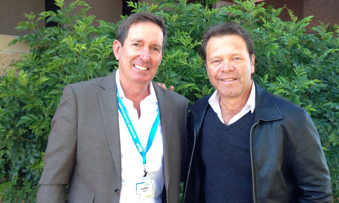 NWHH Board Chair Paul Woodhouse, with popular Australian country singer, Troy Cassar-Daley, one of the guest performers at the Mount Isa Health Expo 2015. Photo: supplied