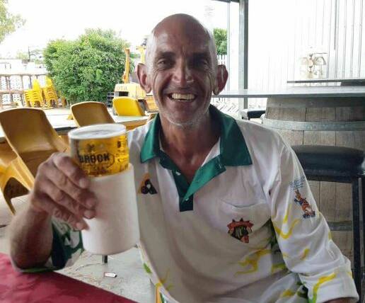 BOWLS BEFORE BEERS: World Record holder for the longest ever solo lawn bowls game, Shayne Barwick, tops up his vital fluids at Cloncurry Lawn Bowls Club on Monday. Photo: Matt Hows