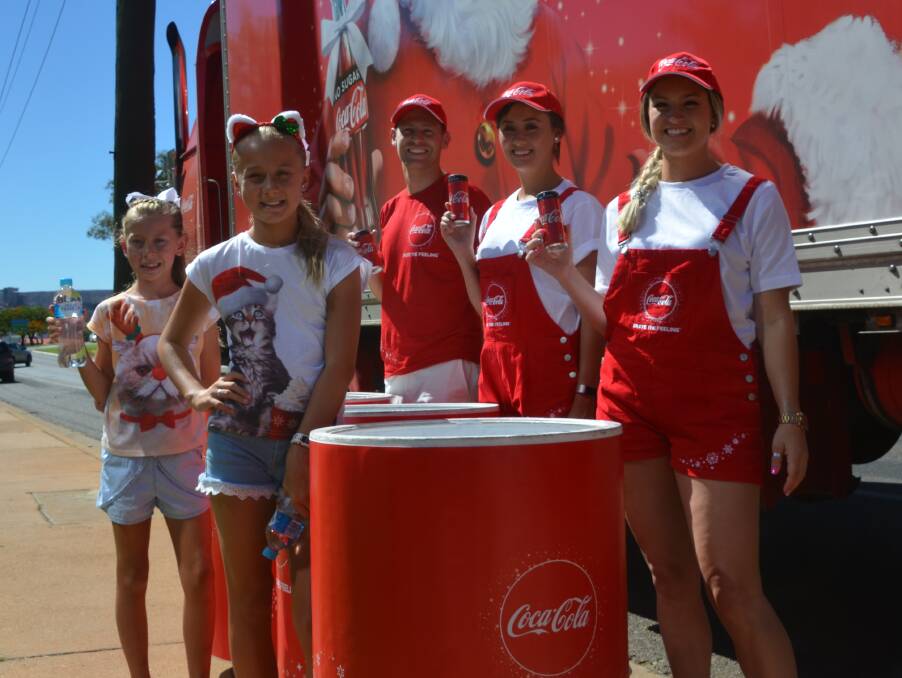 COOL CATS: Minke Adendon (7) and Megan Adendon (10) feeling festive on Wednesday as Coke's Christmas Truck stopped on Marian Street. Photo: Esther MacIntyre