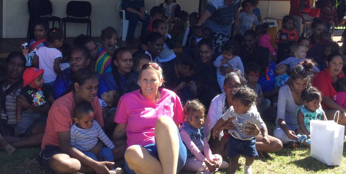Outreach Midwife, Andrea Mitchell with Doomadgee families. Photo: supplied