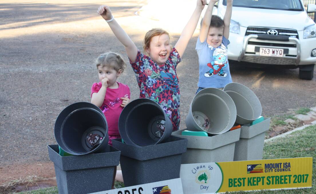 GREEN FINGERS: These young Pioneer residents were ecstatic with their aesthetic achievement. Frankie (2), Brooke (8), and Cooper (4). Photo: supplied