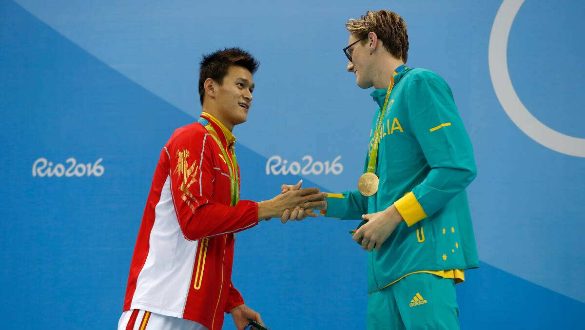 Silver medalist Yang Sun of China and gold medal medalist Mack Horton of Australia pose during the medal 400m freestyle medal ceremony. Photo: Clive Rose/Getty Images