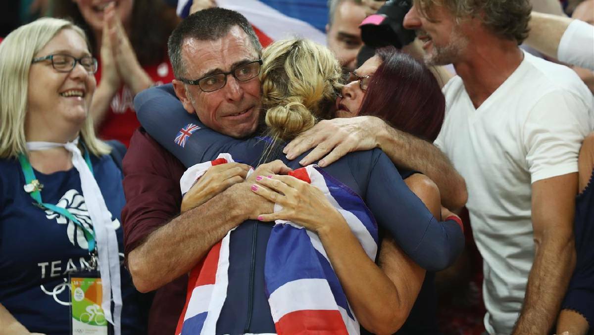 Laura Trott of Great Britain celebrates with the crowd after winning gold in the women's Omnium Points race. Photo: Bryn Lennon/Getty Images