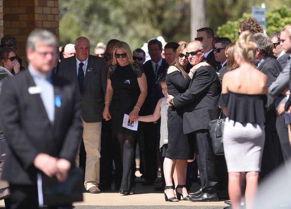 LOVING FAMILY: Jane and Ian Thomson support each other, with daughter Bessie and sons Colin and Braden behind, as more than 150 people gathered to pay their respects to their eldest child Riharna. Photo: Gareth Gardner 100317GG06