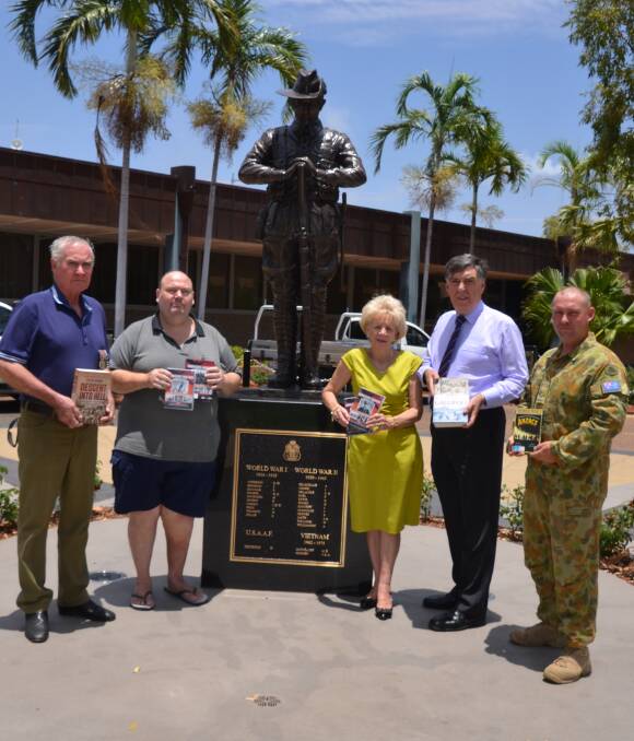 REMEMBERING: RSL Sub Branch vice president Bill Hilton, Barry Byrne, Sandra McGrady, Mayor Tony McGrady and 51 Delta Company LC Dinny Friend with the donated books and DVDS. Picture: Bronwyn Wheatcroft 