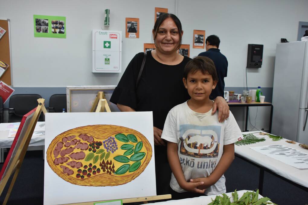 COOLAMON BUSH FOOD: Patricia McDonald grew up experiencing different kinds of bush food as depicted in her painting with  her son Jehkyelin McDonald.