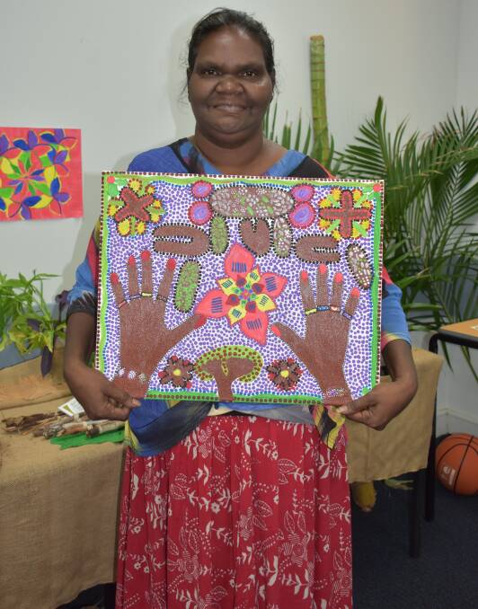 ARTWORK: Josephine Jack was all smiles as she displayed her beautiful artwork.