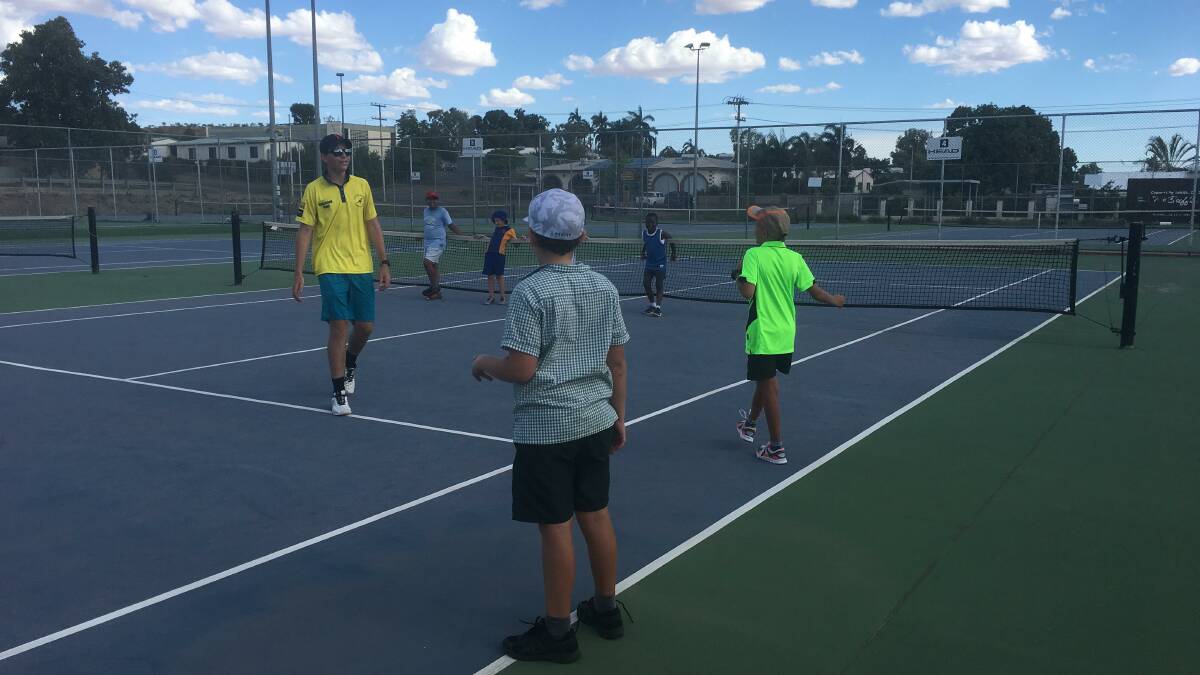 BACK TO BASICS: Tom Braithwaite teaches players what the different lines on the court mean by playing an interactive game. Photo: Supplied  