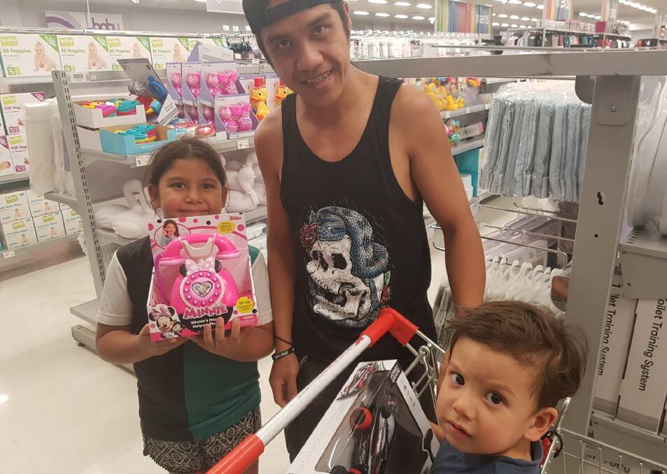 TOYS: Nellmarie Liad, John Liad and Tristan Liad enjoyed an afternoon of shopping.