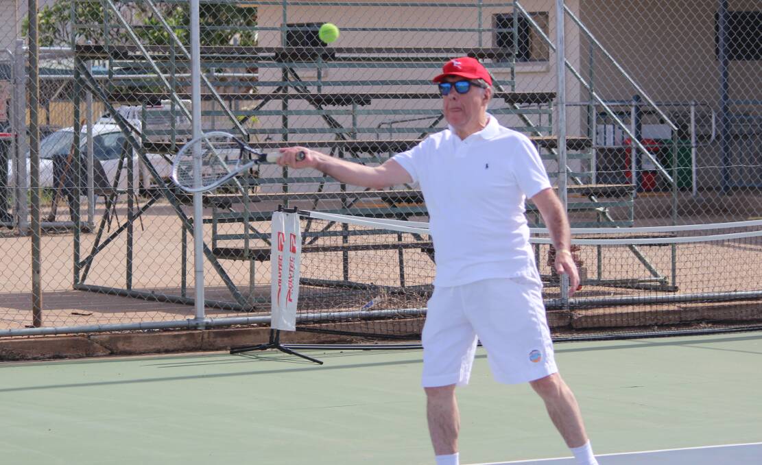 Forehand: Mount Isa Mayor Tony McGrady gets in some practice before playing in the feature match at the Copper City Tennis Club.