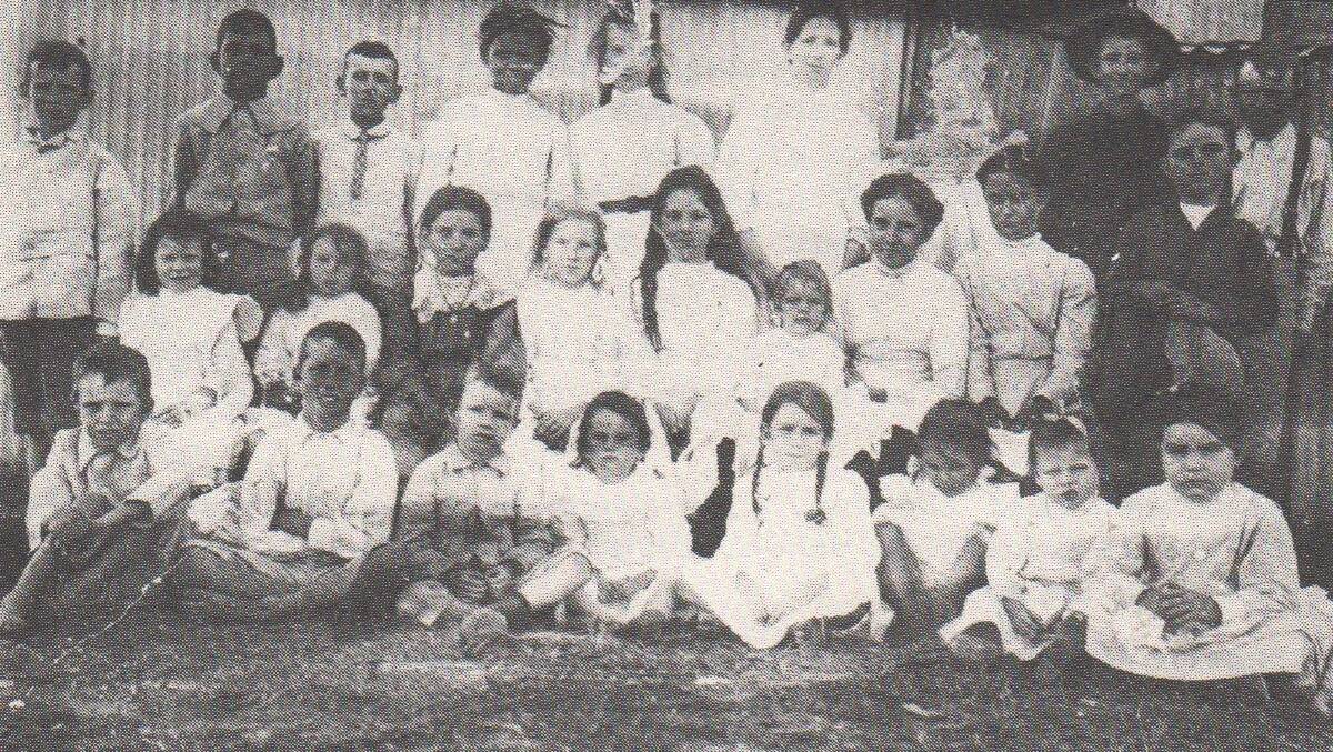 A day at school: School children pose for a photograph in Camooweal in the 1930s. Photographs from Camooweal and Beyond 1884-1984