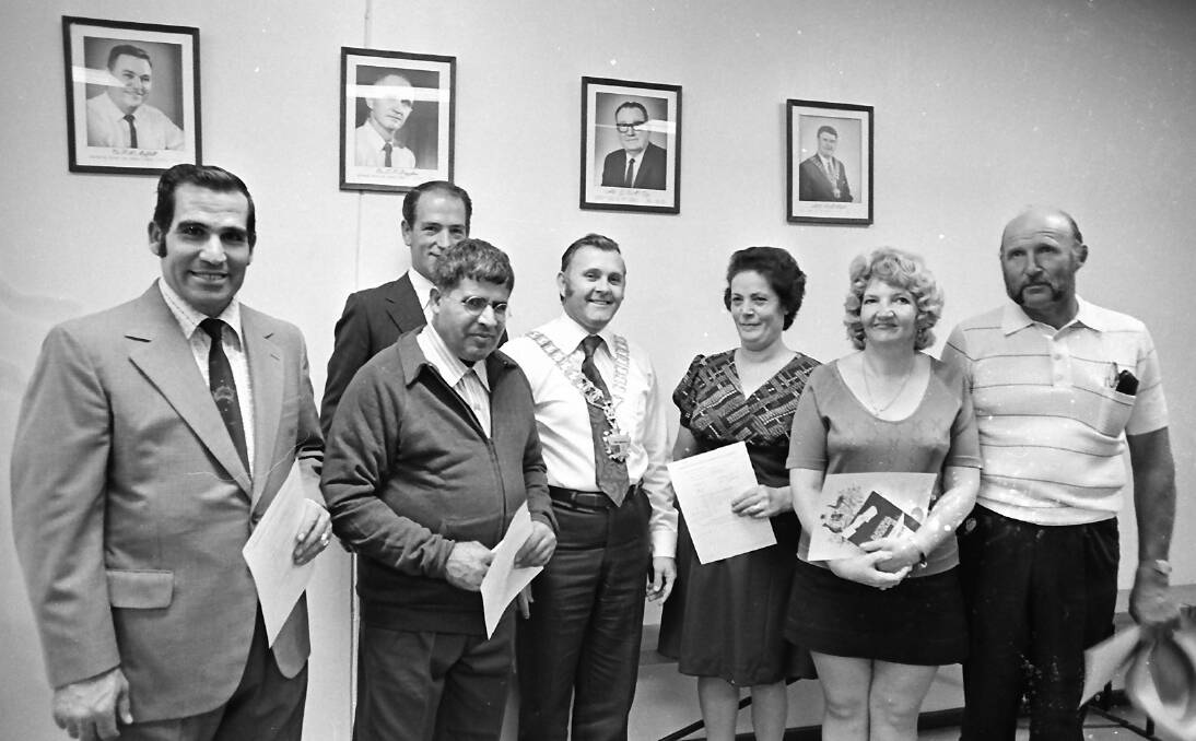 Aussies: Nick Alexi (left), his brother Stevie (front), Mayor Angelo Bertoni and Mrs Paraskevou Alexi with fellow new Australian citizens in 1975.