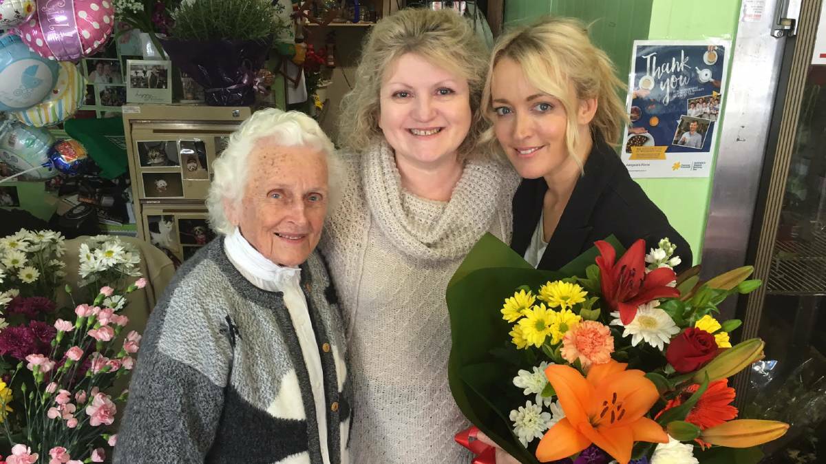 Surprise gift: Megan Barker with her mum Norma and radio star Jackie O. Picture: KIIS