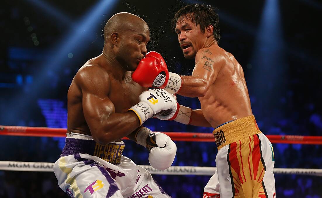 Manny Pacquiao (right) lands a left to the chin of Timothy Bradley in their April 2016 bout. Photo: Christian Petersen/Getty Images