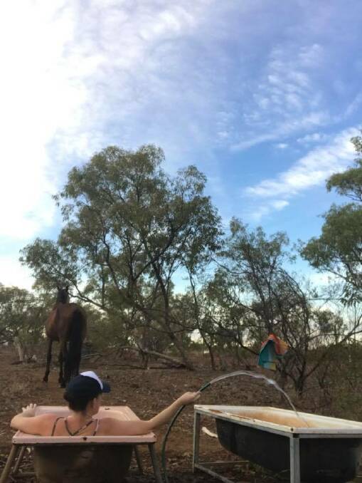 COUNTRY QUEENSLAND: Alecia Wandel photos of country life in the outdoor bath. "Can't  even pretend that we aren't in Mount Isa." 