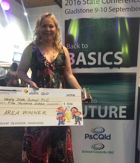 CONGRATULATIONS: Healy P&C President Megan Crowther collects the prize on behalf of Healy State School. Photo supplied.