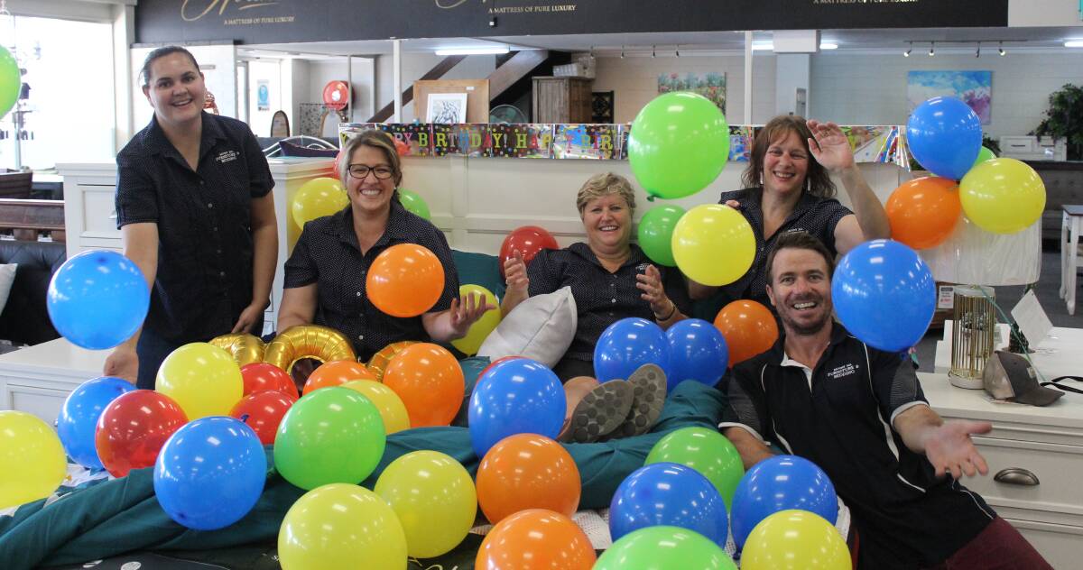 MILESTONE: Mount Isa Furniture and Bedding staff celebrate their first birthday. Photo: Samantha Walton.