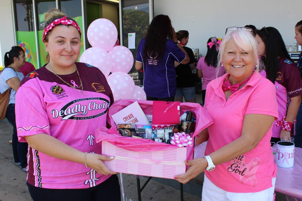 PINK: Deadly Choices representative Daniella Solakovic and Headspace acting manager Jan Hogan holding the raffle prize of the day. Photo: Samantha Walton.