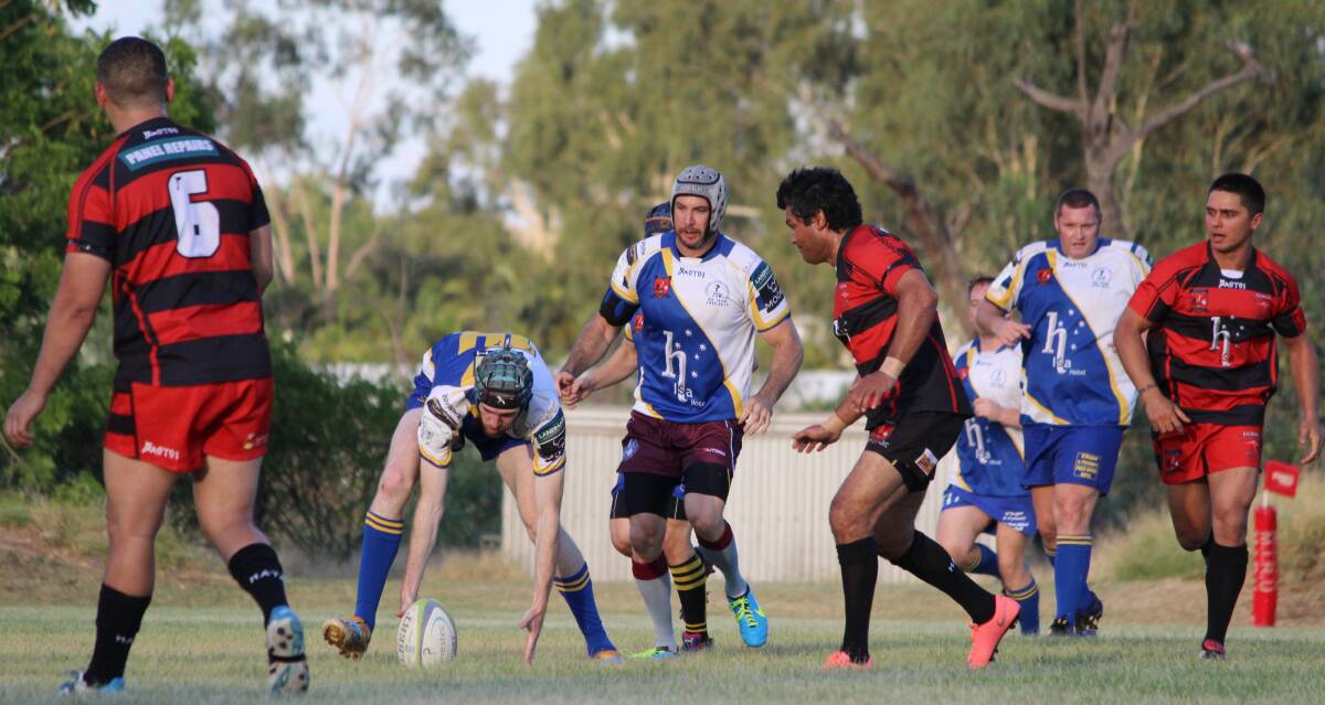 POSSESSION: Cloncurry scoop up the ball and attempt to deflect Euros' defence. Photo: Samantha Walton.