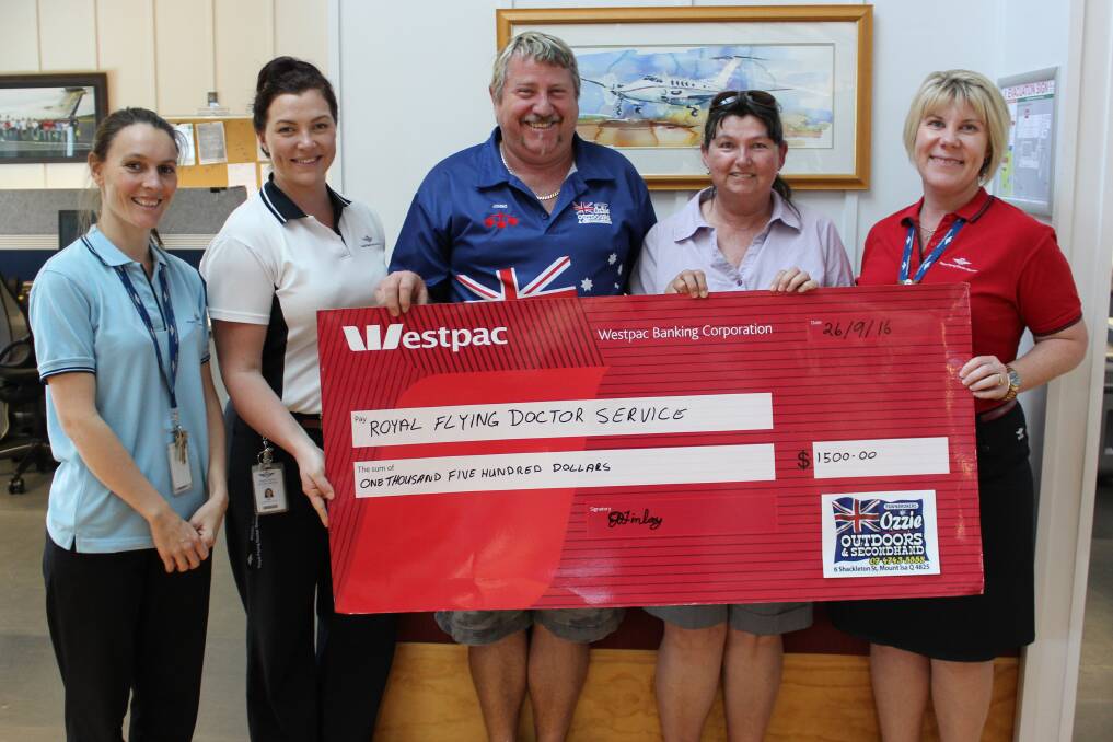 GIVING BACK TO COMMUNITY: RFDS Carly Sidebottom, Rebecca Sears and (far right) Wendy Dunkley accept check from John Davies and Ellen Finlay. Photo: Samantha Walton.