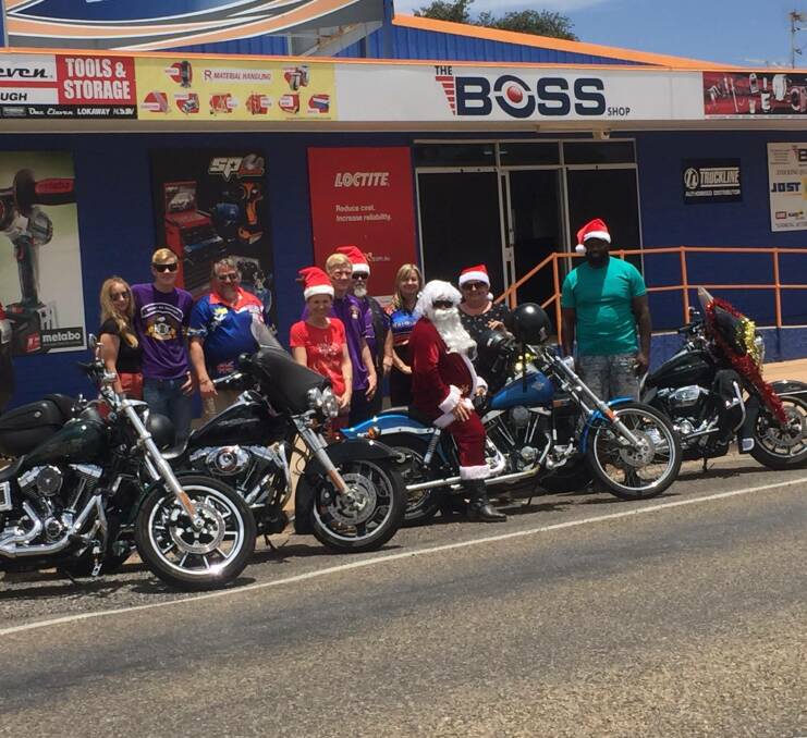 MERRY CHRISTMAS: Mount Isa Hogs, The Boss Shop, Mob FM  and The North West Star prepare for this year's Christmas Light Cavalcade. Photo: Samantha Walton