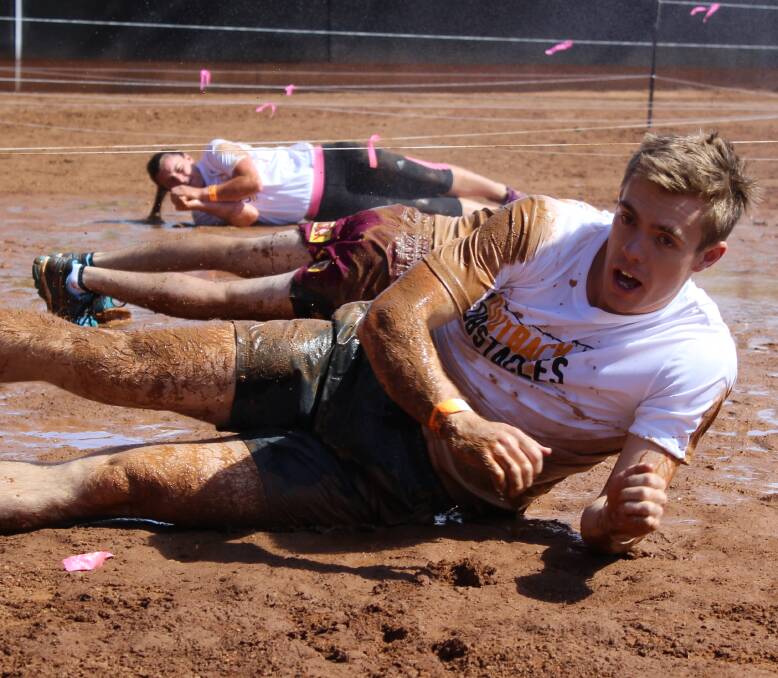 GET DIRTY: Teams go for a roll in the mud in the middle of Buchanan Park rodeo arena. 
Photo: Samantha Walton.