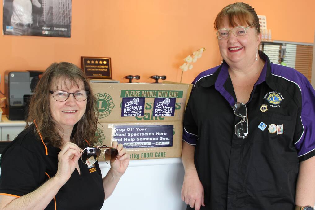 DONATE: Mount Isa Optical office manager Wendy Humphries and Leichhardt Lions president Liza Dowler show off glasses that have already been donated. Photo: Samantha Walton.