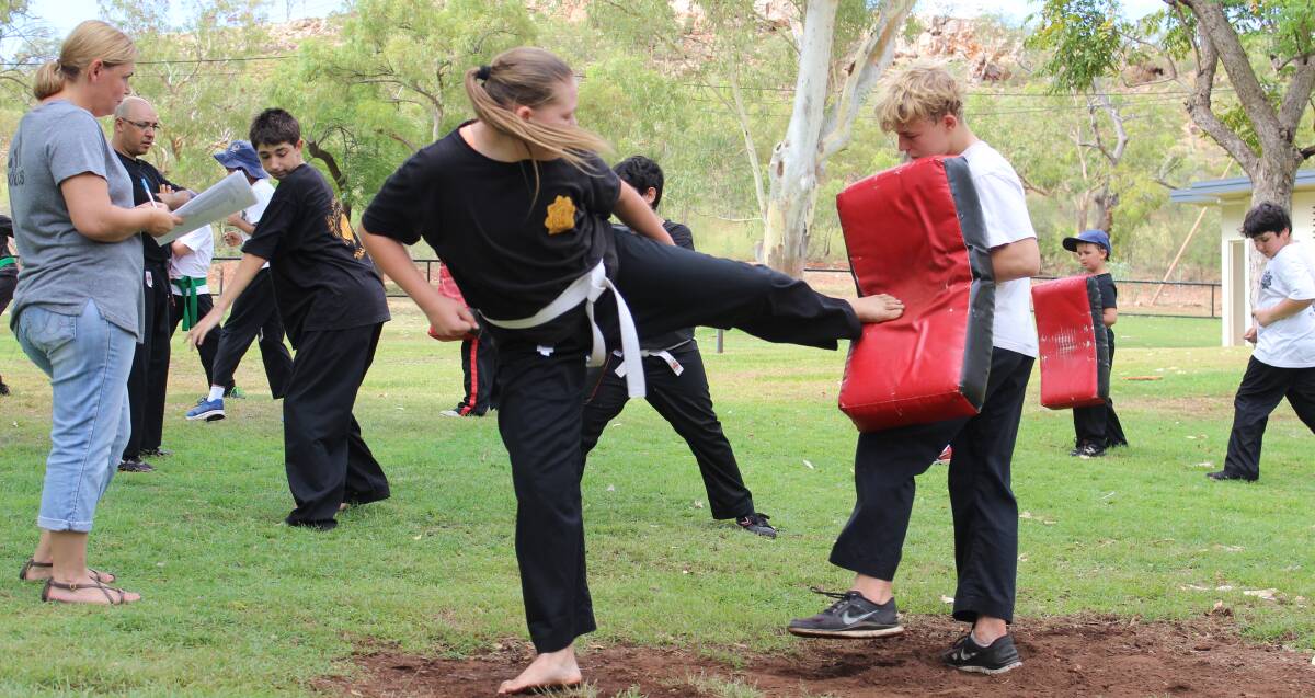 FOCUS: Maddison Trott displays a reverse kick into the bag at the karate grading at Lake Moondarra. Photo: Samantha Walton.