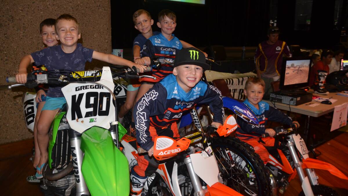 Young enthusiasts try out the machines at the Mount Isa Dirt Bike Club stall.
