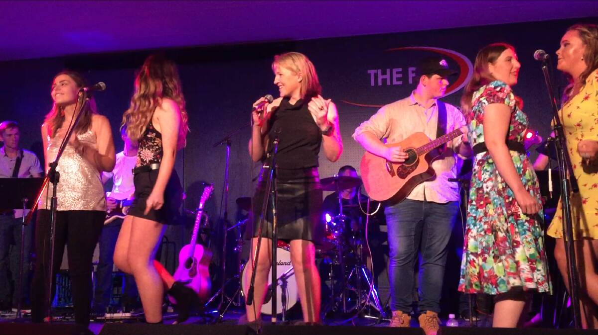 MUSICAL TALENT: Cath Purcell performs at Tamworth Country Music Festival with graduates of the Academy. Photo: supplied