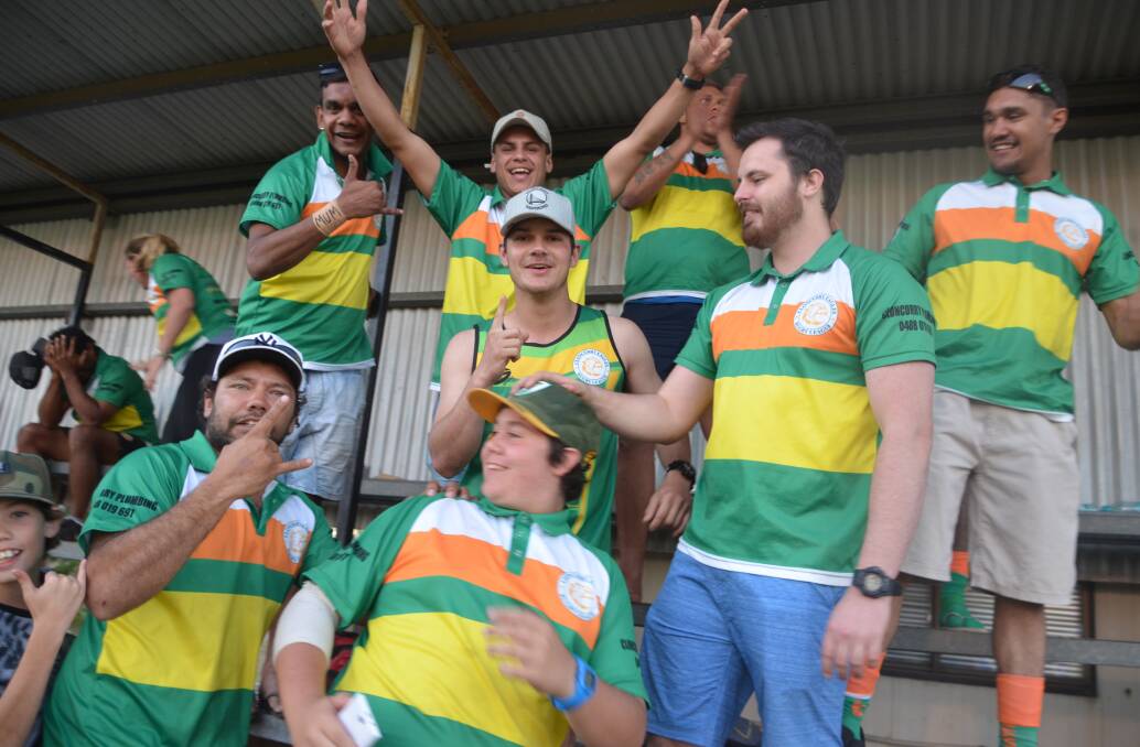 Curry players celebrate their minor premiership win after the end of the Town-Stingers game.