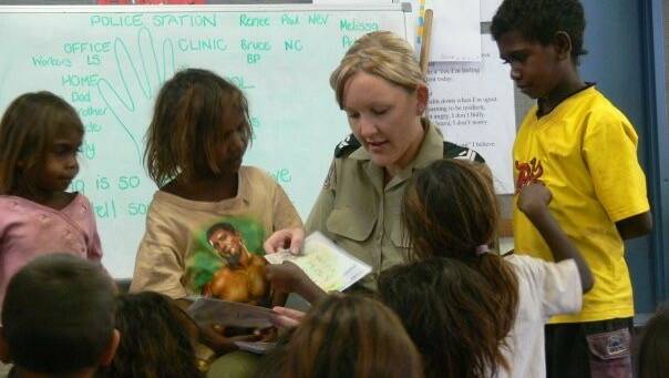 Renne Hanrahan on assignment in the NT with some of the children of Yarralin