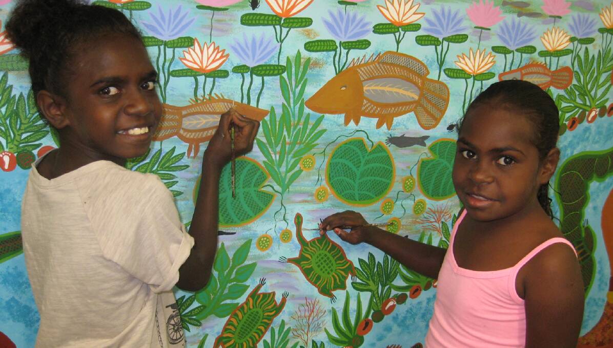 WALL ART: Shakana Casey and Tahquasia Douglas get down to work in the Normanton PCYC project.
