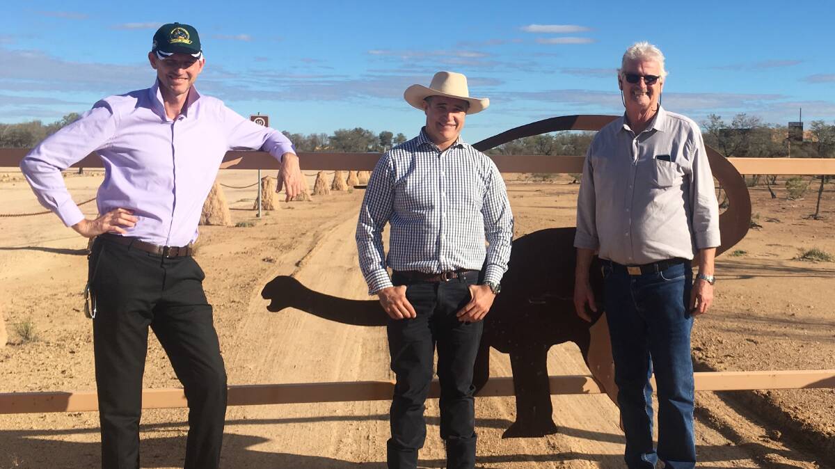 Minister Mark Bailey, Winton mayor Butch Lenton and Robbie at Winton's Age of Dinosaur Discovery.