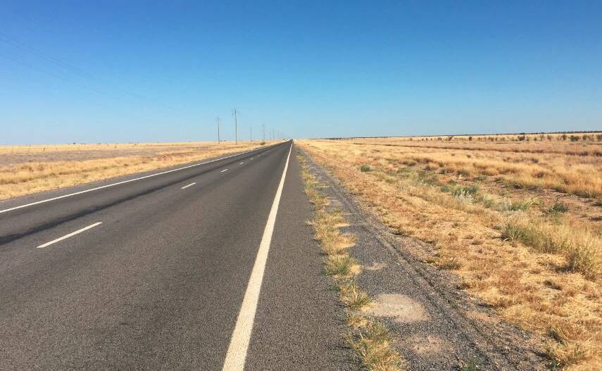The long and lonely road. Editor Derek Barry snapped this image of the Flinders Highway somewhere between Julia Creek and Richmond.