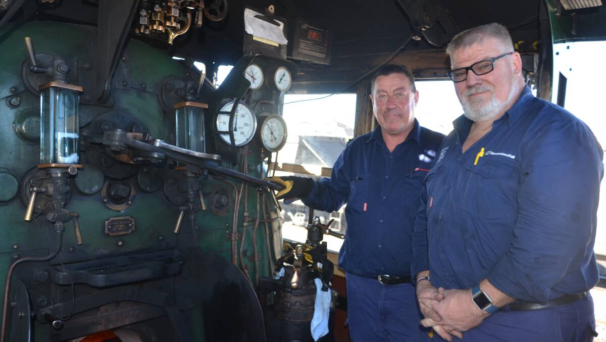 READY TO MOTOR: Queensland Rail Train Operating Inspector John Broderick and driver Malt Bushnell. Photos: Derek Barry