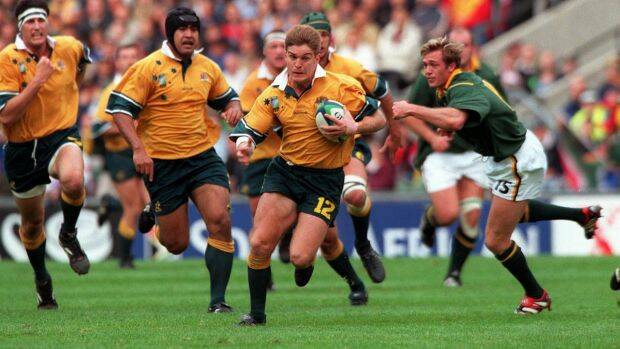 Tim Horan in action against the Springboks at the 1999 World Cup. Photo: Fairfax