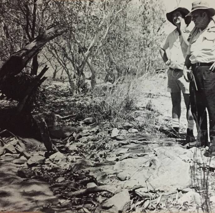 Police inspect the site where Englishman Ronald Nicholls was found dead in December 1976. Nicholls went missing in desolate bushland near Lake Julius