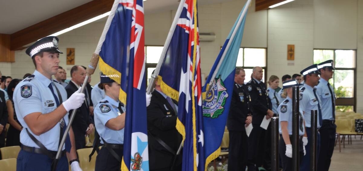 RESPECT: The honour guard about to put the flags on the hoist at Good Shepherd Church Police Remembrance Day. Photo: Derek Barry