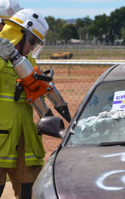 RESCUERS: Firies go through their paces with the Jaws of Life. Photo: Derek Barry