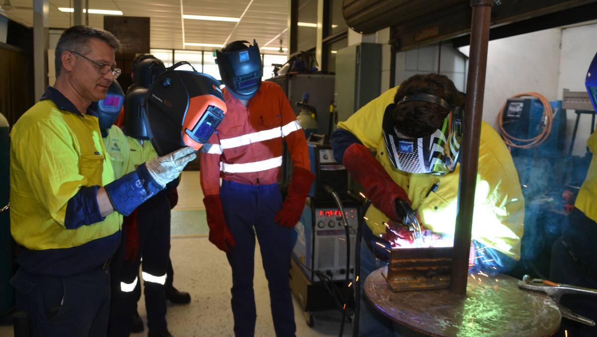 SKILLS: Student Jayden Richters does some welding under the instruction of TAFE teacher Greg Weremchuk. Photo: Derek Barry