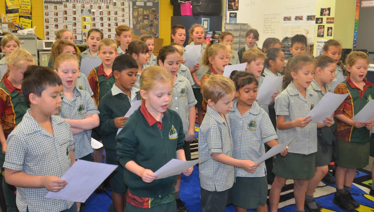 SONG SHEET: St Joseph's years 1-3 students practice for Friday night's concert. Photo: Derek Barry