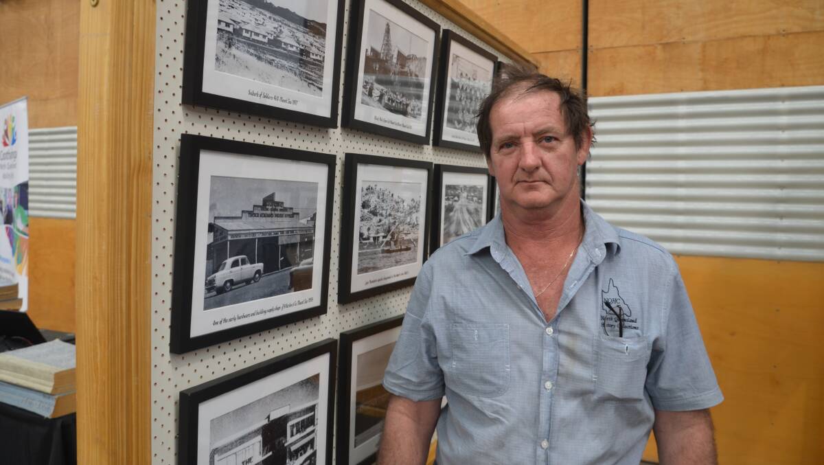 COLLECTOR: Local man Brian Adamson with his collection of historical photos at the Mount Isa Show. Photo: Derek Barry