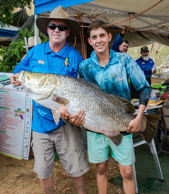 TOP CATCH: Bill Rigby with Joshua Moren who caught a barra weighing 26.7kgs smashing the Lake Moondarra Fishing Classic record. Photo: Isaeagle Photography