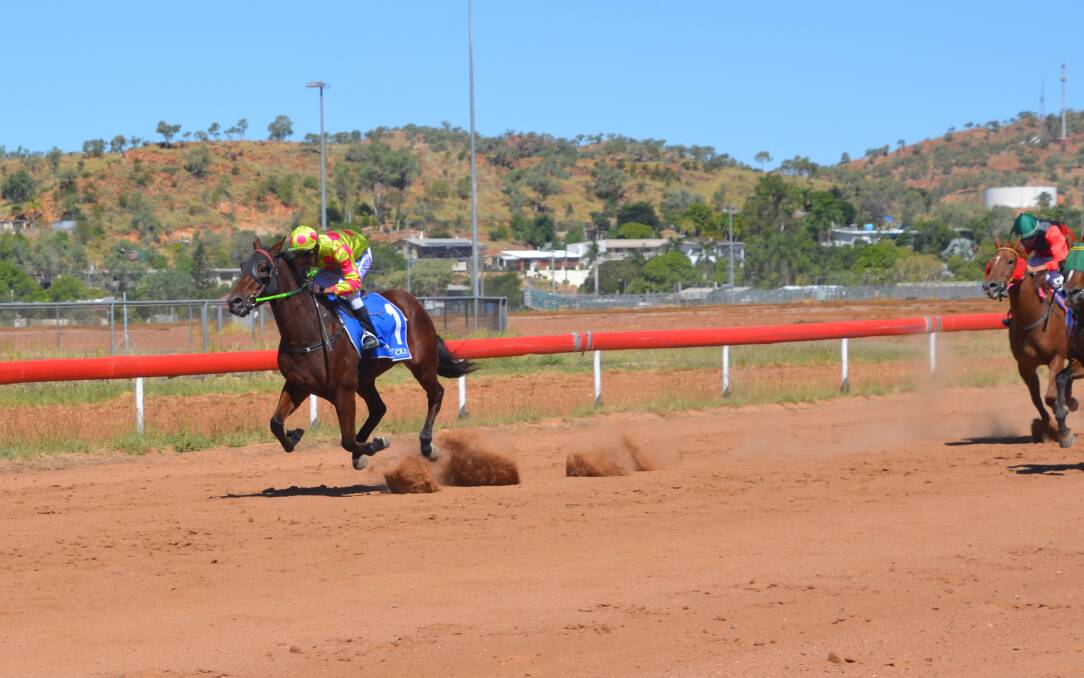 CLEAR WINNER: Terrance Hill rides The Monkey to victory in Race 3 by two lengths from Messines Rose at Mount Isa on Sunday. Photo: Derek Barry