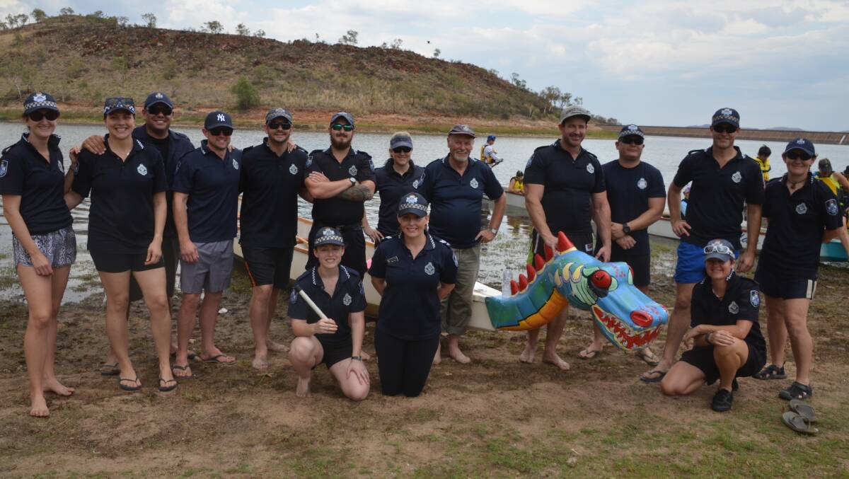 The Police dragon boat racing team pose for a photo after their race at the Lake Moondarra Fishing Classic.