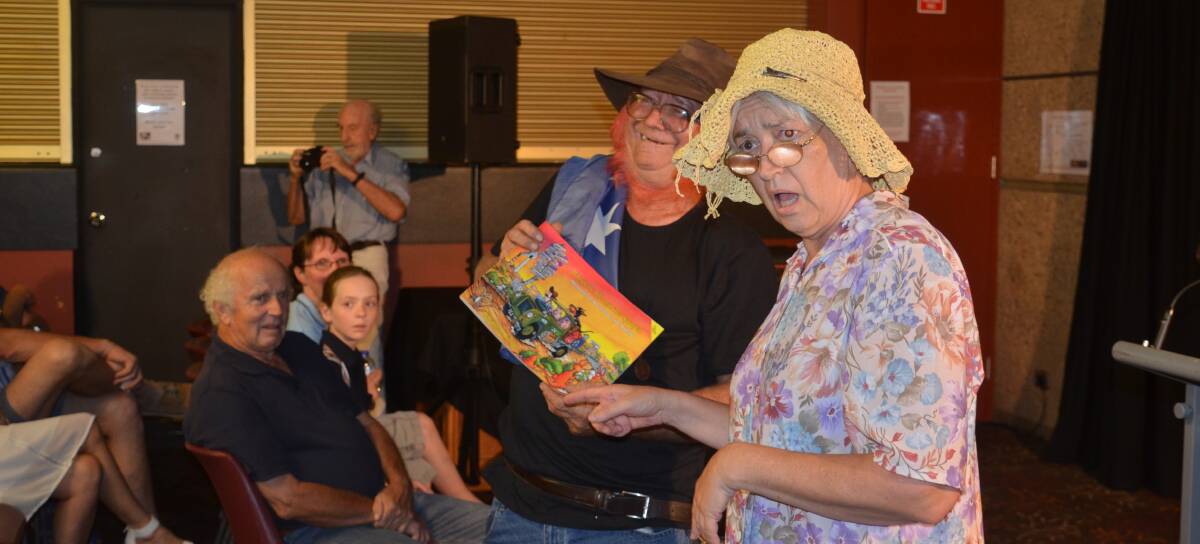 BOOK LAUNCH: "The Odd Couple" help launch Kim Maree Burton's "Whispers in the Spinifex: Memories of Mount Isa in the Making" at the Civic Centre on Thursday. Photo: Derek Barry