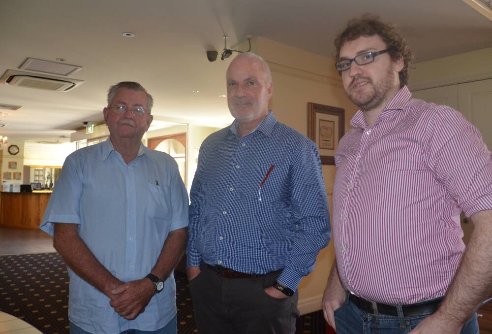 PRICE QUERY: Bill Gardner (left) meets Kim Wood and Matthew Deck of the Queensland Productivity Commission in Mount Isa. Photo: Derek Barry