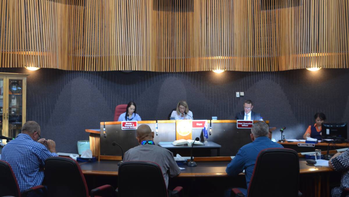 Mayor Joyce McCulloch hands down the Mount Isa City Council budget on Wednesday morning.