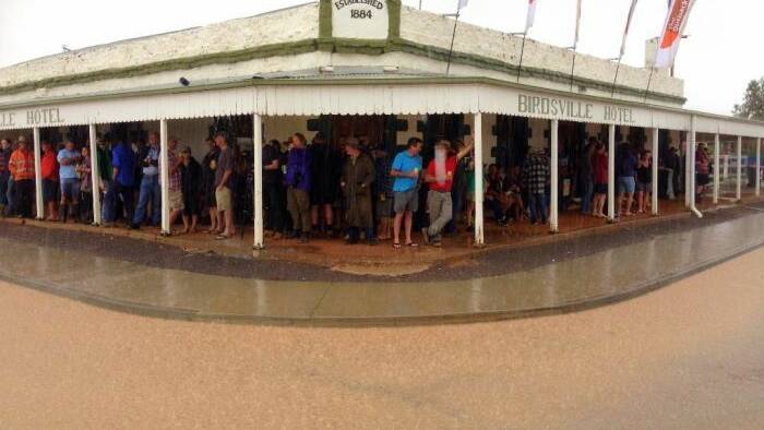 People find what entertainment they can in a wet Birdsville. (Photo courtesy ABC)